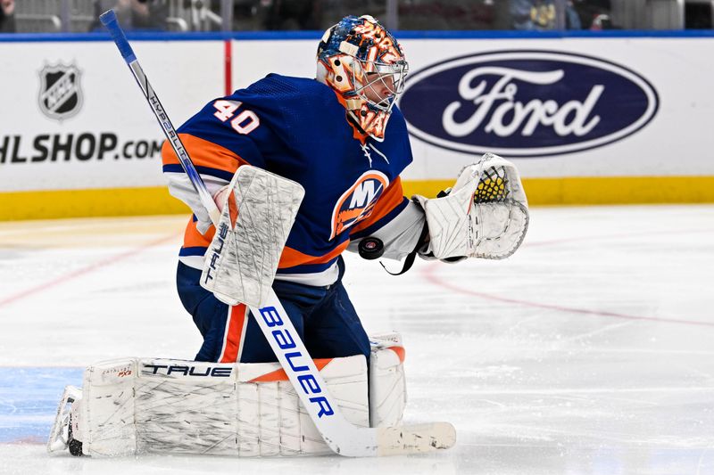 Apr 11, 2024; Elmont, New York, USA; New York Islanders goaltender Semyon Varlamov (40) makes a save against the Montreal Canadiens during the third period at UBS Arena. Mandatory Credit: Dennis Schneidler-USA TODAY Sports