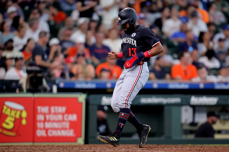 Jun 2, 2024; Houston, Texas, USA; Minnesota Twins pinch runner Manuel Margot (13) crosses home plate to score a run against the Houston Astros during the eighth inning at Minute Maid Park. Mandatory Credit: Erik Williams-USA TODAY Sports