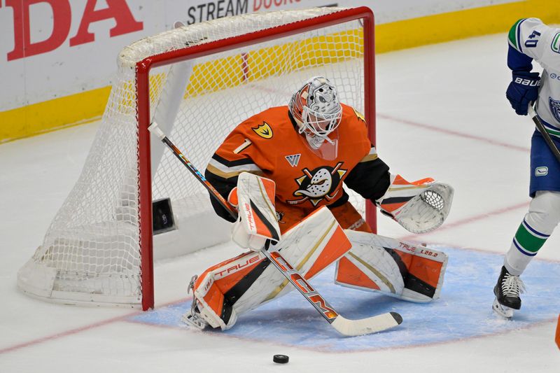 Nov 5, 2024; Anaheim, California, USA; Anaheim Ducks goaltender Lukas Dostal (1) makes a save in the first period against the Vancouver Canucks at Honda Center. Mandatory Credit: Jayne Kamin-Oncea-Imagn Images