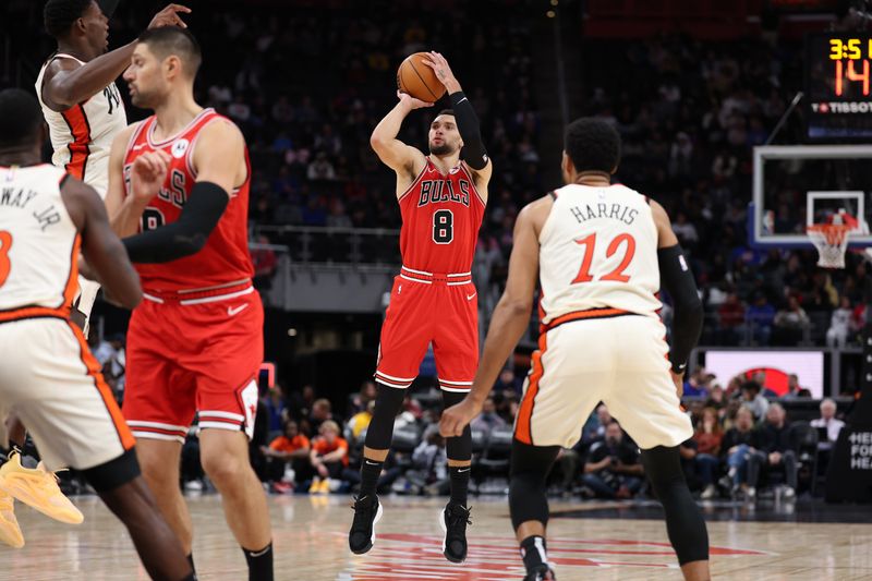 DETROIT, MICHIGAN - NOVEMBER 18: Zach LaVine #8 of the Chicago Bulls takes a second half three point shot behind Tobias Harris #12 of the Detroit Pistons at Little Caesars Arena on November 18, 2024 in Detroit, Michigan. Chicago won the game 122-112. NOTE TO USER: User expressly acknowledges and agrees that, by downloading and or using this photograph, User is consenting to the terms and conditions of the Getty Images License. (Photo by Gregory Shamus/Getty Images)