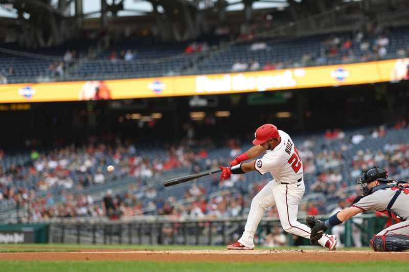May 20, 2025; Washington, District of Columbia, USA; Washington Nationals catcher Keibert Ruiz (20) hits an RBI double against the Atlanta Braves during the first inning at Nationals Park. Mandatory Credit: Geoff Burke-Imagn Images