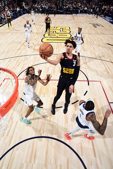 DENVER, CO - DECEMBER 18: Julian Strawther #3 of the Denver Nuggets drives to the basket during the game against the Dallas Mavericks on December 18, 2023 at the Ball Arena in Denver, Colorado. NOTE TO USER: User expressly acknowledges and agrees that, by downloading and/or using this Photograph, user is consenting to the terms and conditions of the Getty Images License Agreement. Mandatory Copyright Notice: Copyright 2023 NBAE (Photo by Garrett Ellwood/NBAE via Getty Images)