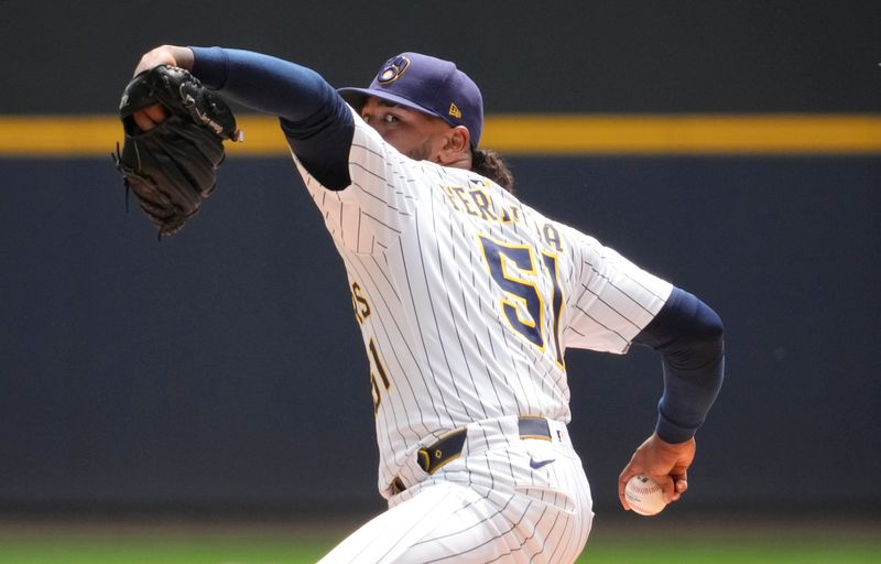 Jun 8, 2025; Milwaukee, Wisconsin, USA; Milwaukee Brewers pitcher Freddy Peralta (51) delivers a pitch against the San Diego Padres in the first inning at American Family Field. Mandatory Credit: Michael McLoone-Imagn Images