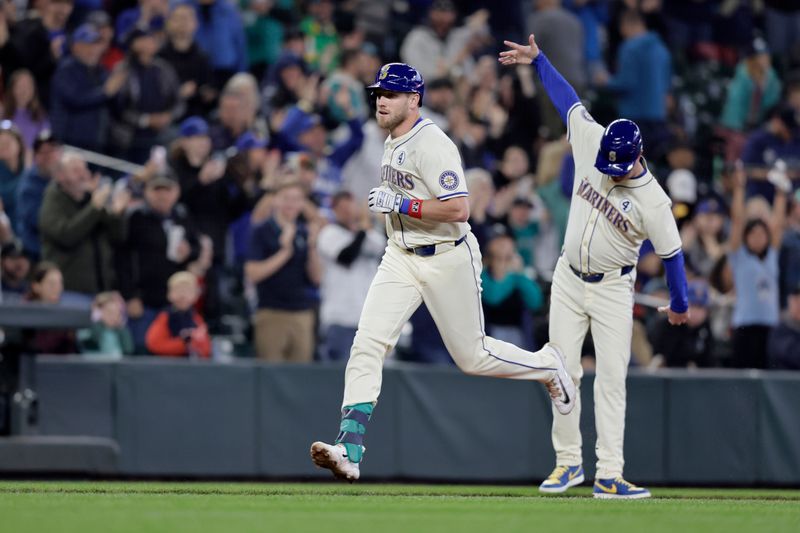 Jun 2, 2024; Seattle, Washington, USA; Seattle Mariners left fielder Luke Raley (20) jogs the bases after hitting a solo home run against the Los Angeles Angels during the fourth inning at T-Mobile Park. Mandatory Credit: John Froschauer-USA TODAY Sports