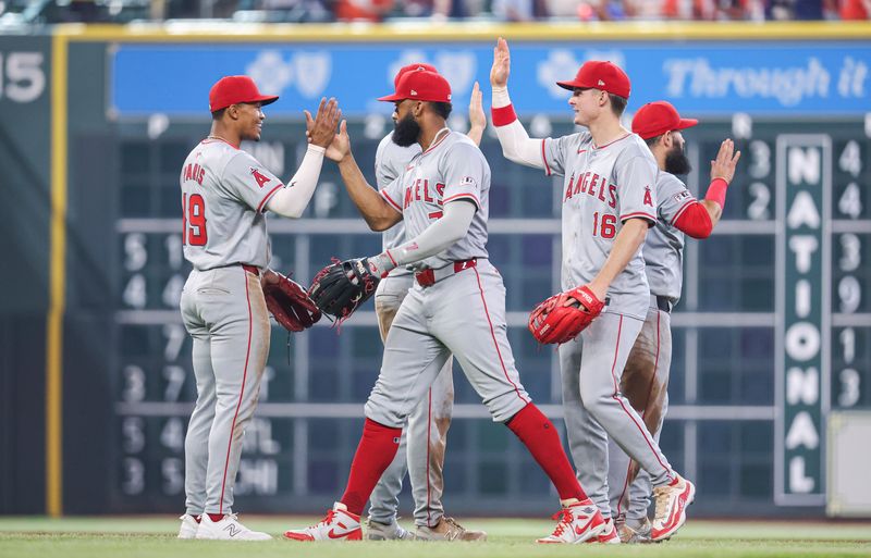 May 22, 2024; Houston, Texas, USA; Los Angeles Angels second baseman Kyren Paris (19) celebrates with teammates afer the game against the Houston Astros at Minute Maid Park. Mandatory Credit: Troy Taormina-USA TODAY Sports