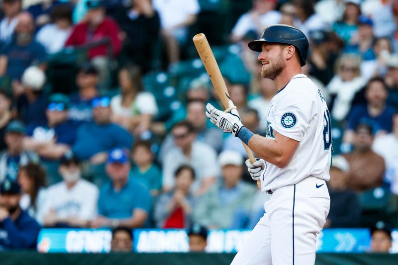 Jul 2, 2024; Seattle, Washington, USA; Seattle Mariners left fielder Luke Raley (20) reacts after striking out against the Baltimore Orioles to end the first inning at T-Mobile Park. Mandatory Credit: Joe Nicholson-USA TODAY Sports