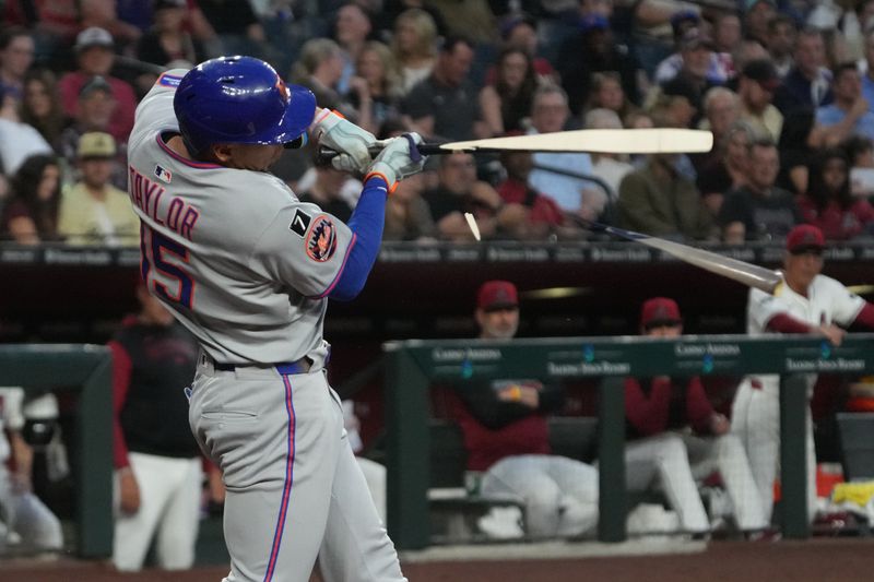 May 6, 2025; Phoenix, Arizona, USA; New York Mets outfielder Tyrone Taylor (15) breaks his bat against the Arizona Diamondbacks in the third inning at Chase Field. Mandatory Credit: Rick Scuteri-Imagn Images