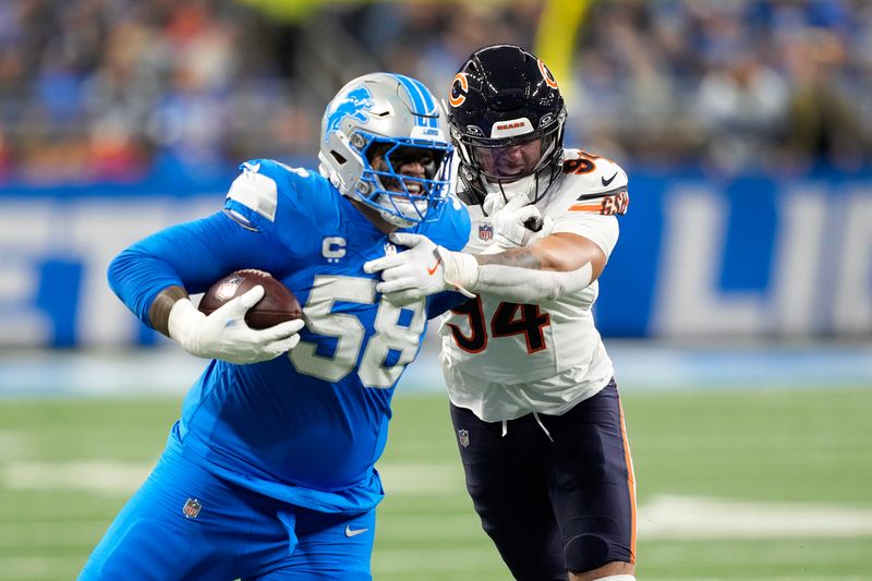 Detroit Lions offensive tackle Penei Sewell (58) tries to break the tackle of Chicago Bears defensive end Austin Booker (94) during the first half of an NFL football game, Sunday, Nov. 17, 2024, in Detroit. (AP Photo/Carlos Osorio)