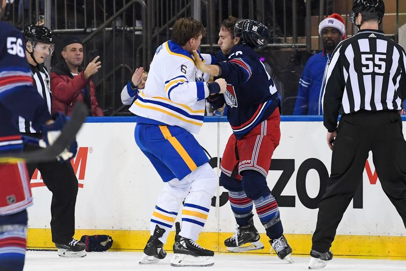 Dec 23, 2023; New York, New York, USA; New York Rangers left wing Will Cuylle (50) and Buffalo Sabres defenseman Erik Johnson (6) fight during the second period at Madison Square Garden. Mandatory Credit: Dennis Schneidler-USA TODAY Sports