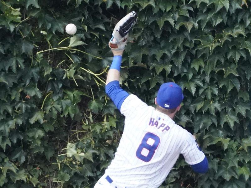 Aug 3, 2024; Chicago, Illinois, USA; Chicago Cubs outfielder Ian Happ (8) can’t catch a triple hit by St. Louis Cardinals outfielder Tommy Pham (not pictured) during the ninth inning at Wrigley Field. Mandatory Credit: David Banks-USA TODAY Sports