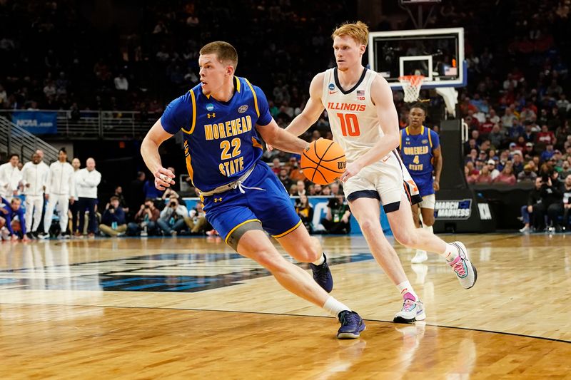 Mar 21, 2024; Omaha, NE, USA; =Morehead State Eagles guard Riley Minix (22) drives past Illinois Fighting Illini guard Luke Goode (10) during the first half in the first round of the 2024 NCAA Tournament at CHI Health Center Omaha. Mandatory Credit: Dylan Widger-USA TODAY Sports