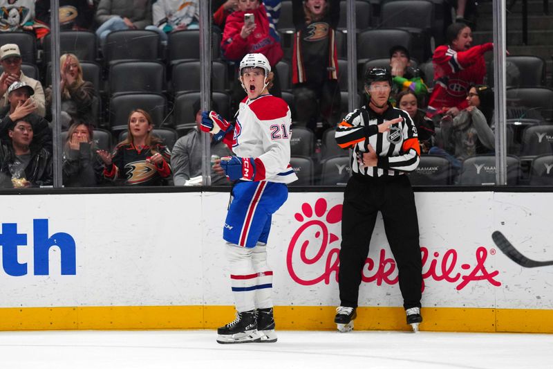 Nov 22, 2023; Anaheim, California, USA; Montreal Canadiens defenseman Kaiden Guhle (21) celebrates after a goal against the Anaheim Ducks in the first period at Honda Center. Mandatory Credit: Kirby Lee-USA TODAY Sports