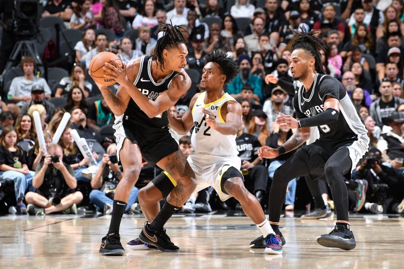 SAN ANTONIO, TX - NOVEMBER 9: Devin Vassell #24 of the San Antonio Spurs looks to pass the ball during the game against the Utah Jazz on November 9, 2024 at the Frost Bank Center in San Antonio, Texas. NOTE TO USER: User expressly acknowledges and agrees that, by downloading and or using this photograph, user is consenting to the terms and conditions of the Getty Images License Agreement. Mandatory Copyright Notice: Copyright 2024 NBAE (Photos by Logan Riely/NBAE via Getty Images)