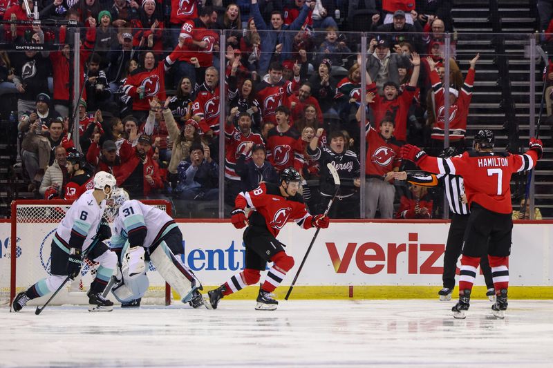 Dec 6, 2024; Newark, New Jersey, USA; New Jersey Devils right wing Timo Meier (28) celebrates his goal against the Seattle Kraken during the third period at Prudential Center. Mandatory Credit: Ed Mulholland-Imagn Images