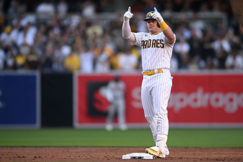 Apr 14, 2022; San Diego, California, USA; San Diego Padres designated hitter Luke Voit (45) gestures toward the dugout after hitting an RBI double during the second inning against the Atlanta Braves at Petco Park. Mandatory Credit: Orlando Ramirez-USA TODAY Sports