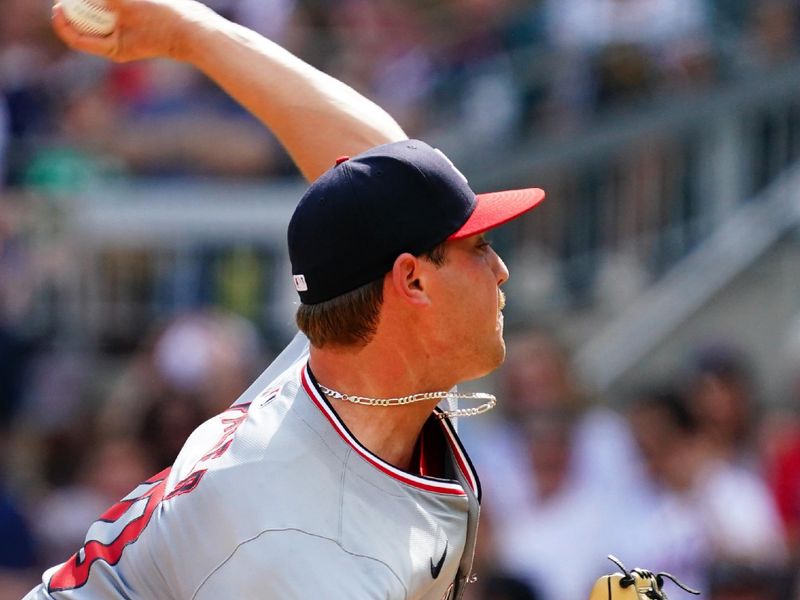 May 27, 2024; Cumberland, Georgia, USA; Washington Nationals pitcher Mitchell Parker (70) fires off a pitch against the Atlanta Braves during the second inning at Truist Park. Mandatory Credit: John David Mercer-USA TODAY Sports