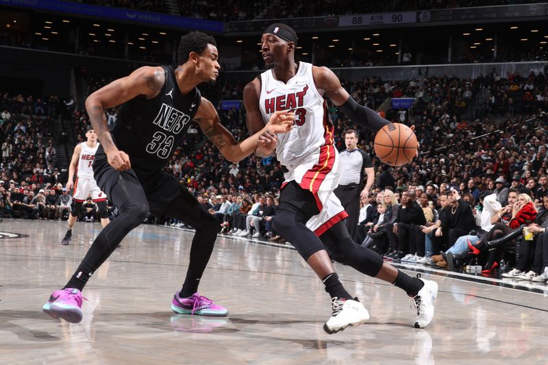 BROOKLYN, NY - JANUARY 15: Bam Adebayo #13 of the Miami Heat dribbles the ball during the game against the Brooklyn Nets on January 15, 2024 at Barclays Center in Brooklyn, New York. NOTE TO USER: User expressly acknowledges and agrees that, by downloading and or using this Photograph, user is consenting to the terms and conditions of the Getty Images License Agreement. Mandatory Copyright Notice: Copyright 2024 NBAE (Photo by Nathaniel S. Butler/NBAE via Getty Images)