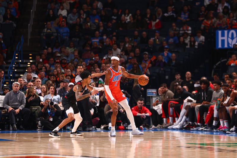 OKLAHOMA CITY, OK - JANUARY 23: Shai Gilgeous-Alexander #2 of the Oklahoma City Thunder handles the ball against defender Anfernee Simons #1 of the Portland Trail Blazers during the game on January 23, 2024 at Paycom Arena in Oklahoma City, Oklahoma. NOTE TO USER: User expressly acknowledges and agrees that, by downloading and or using this photograph, User is consenting to the terms and conditions of the Getty Images License Agreement. Mandatory Copyright Notice: Copyright 2024 NBAE (Photo by Zach Beeker/NBAE via Getty Images)