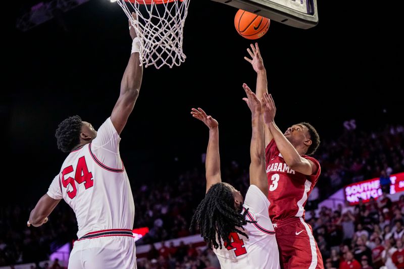 Jan 31, 2024; Athens, Georgia, USA; Alabama Crimson Tide guard Rylan Griffen (3) shoots over Georgia Bulldogs guard Silas Demary Jr. (4) during the second half at Stegeman Coliseum. Mandatory Credit: Dale Zanine-USA TODAY Sports