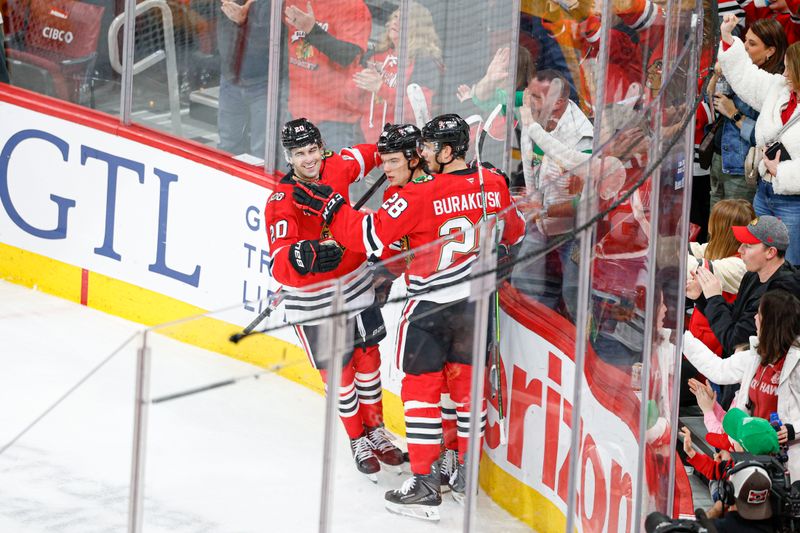 Mar 22, 2026; Chicago, Illinois, USA; Chicago Blackhawks center Connor Bedard (98) celebrates with teammates after scoring against the Nashville Predators during the second period at United Center. Mandatory Credit: Kamil Krzaczynski-Imagn Images