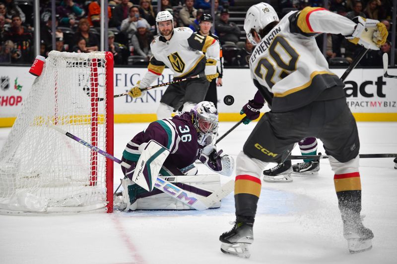 Dec 27, 2023; Anaheim, California, USA; Anaheim Ducks goaltender John Gibson (36) blocks a shot against Vegas Golden Knights center Chandler Stephenson (20) during the second period at Honda Center. Mandatory Credit: Gary A. Vasquez-USA TODAY Sports