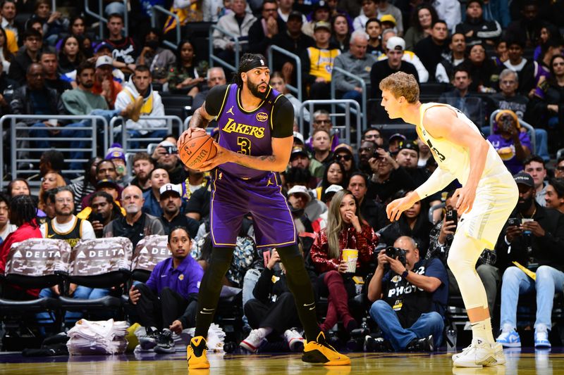 LOS ANGELES, CA - NOVEMBER 19: Anthony Davis #3 of the Los Angeles Lakers handles the ball during the game against the Utah Jazz during the Emirates NBA Cup game on November 19, 2024 at Crypto.Com Arena in Los Angeles, California. NOTE TO USER: User expressly acknowledges and agrees that, by downloading and/or using this Photograph, user is consenting to the terms and conditions of the Getty Images License Agreement. Mandatory Copyright Notice: Copyright 2024 NBAE (Photo by Adam Pantozzi/NBAE via Getty Images)