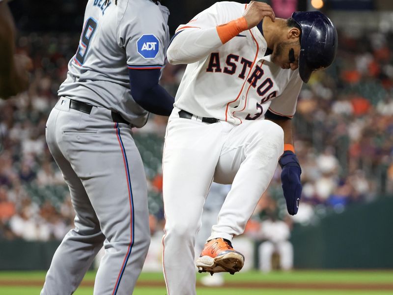 Jul 9, 2024; Houston, Texas, USA; Houston Astros shortstop Jeremy Pena (3) beats the throw back to Miami Marlins first baseman Josh Bell (9) at first base in the sixth inning at Minute Maid Park. Miami Marlins starting pitcher Trevor Rogers (28) (not pictured) was called for a balk on the play . Mandatory Credit: Thomas Shea-USA TODAY Sports