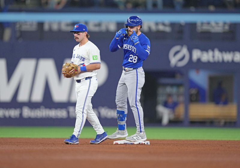 May 1, 2024; Toronto, Ontario, CAN; Kansas City Royals center fielder Kyle Isbel (28) celebrates hitting a double against the Toronto Blue Jays during the sixth inning at Rogers Centre. Mandatory Credit: Nick Turchiaro-USA TODAY Sports