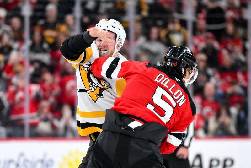 Nov 8, 2025; Newark, New Jersey, USA; Pittsburgh Penguins right wing Anthony Mantha (39) and New Jersey Devils defenseman Brenden Dillon (5) fight during the first period at Prudential Center. Mandatory Credit: John Jones-Imagn Images