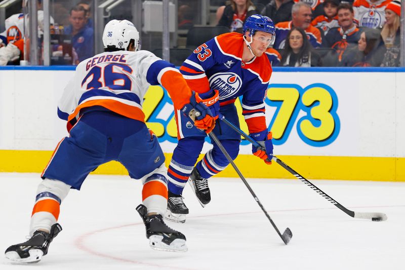 Nov 12, 2024; Edmonton, Alberta, CAN; Edmonton Oilers forward Jeff Skinner (53) takes a shot in front of New York Islanders defensemen Isaiah George (36) during the first period at Rogers Place. Mandatory Credit: Perry Nelson-Imagn Images