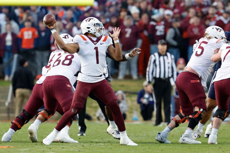 Nov 25, 2023; Charlottesville, Virginia, USA; Virginia Tech Hokies quarterback Kyron Drones (1) passes the ball against the Virginia Cavaliers during the second quarter at Scott Stadium. Mandatory Credit: Geoff Burke-USA TODAY Sports