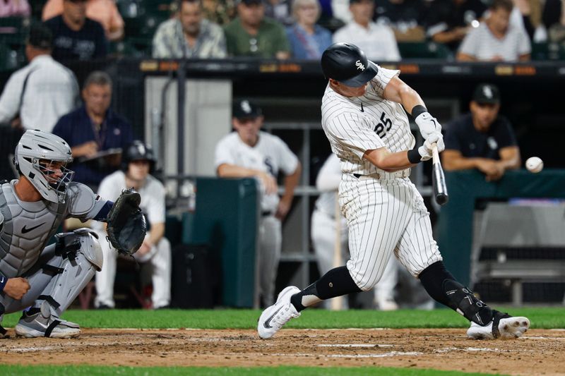 Aug 23, 2024; Chicago, Illinois, USA; Chicago White Sox first baseman Andrew Vaughn (25) singles against the Detroit Tigers during the fourth inning at Guaranteed Rate Field. Mandatory Credit: Kamil Krzaczynski-USA TODAY Sports