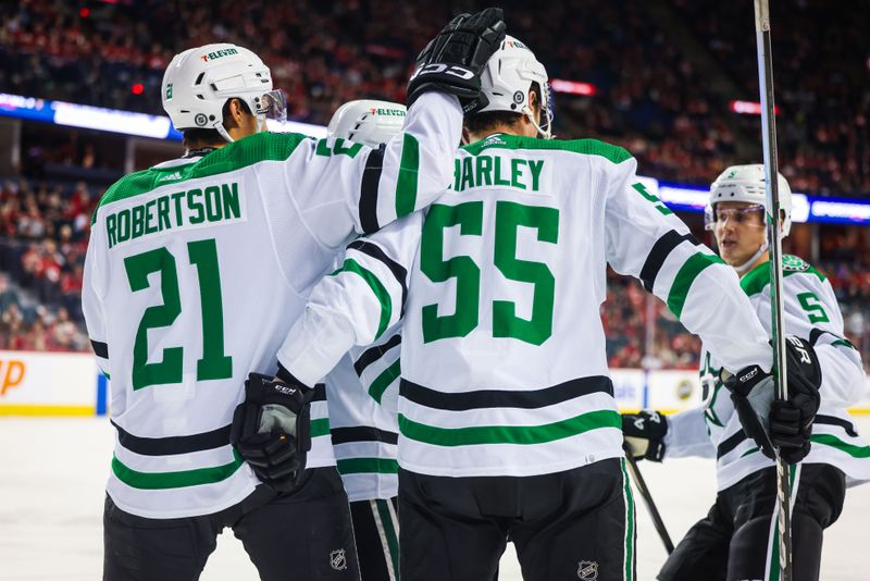 Nov 30, 2023; Calgary, Alberta, CAN; Dallas Stars defenseman Thomas Harley (55) celebrates his goal with teammates against the Calgary Flames during the first period at Scotiabank Saddledome. Mandatory Credit: Sergei Belski-USA TODAY Sports