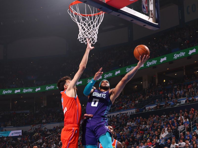 OKLAHOMA CITY, OK - FEBUARY 2:  Miles Bridges #0 of the Charlotte Hornets goes to the basket during the game  on February 2, 2024 at Paycom Arena in Oklahoma City, Oklahoma. NOTE TO USER: User expressly acknowledges and agrees that, by downloading and or using this photograph, User is consenting to the terms and conditions of the Getty Images License Agreement. Mandatory Copyright Notice: Copyright 2024 NBAE (Photo by Zach Beeker/NBAE via Getty Images)