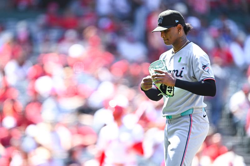 May 25, 2025; Anaheim, California, USA; Miami Marlins starting pitcher Edward Cabrera (27) walks off the field against the Los Angeles Angels during the sixth inning at Angel Stadium. Mandatory Credit: Jonathan Hui-Imagn Images