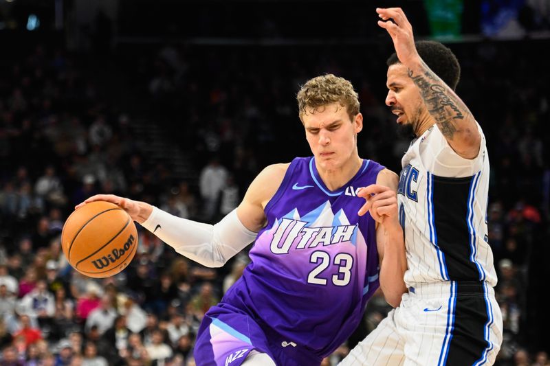 SALT LAKE CITY, UTAH - FEBRUARY 01: Lauri Markkanen #23 of the Utah Jazz bumps into Cole Anthony #50 of the Orlando Magic during the second half of a game at Delta Center on February 01, 2025 in Salt Lake City, Utah. NOTE TO USER: User expressly acknowledges and agrees that, by downloading and or using this photograph, User is consenting to the terms and conditions of the Getty Images License Agreement. (Photo by Alex Goodlett/Getty Images)