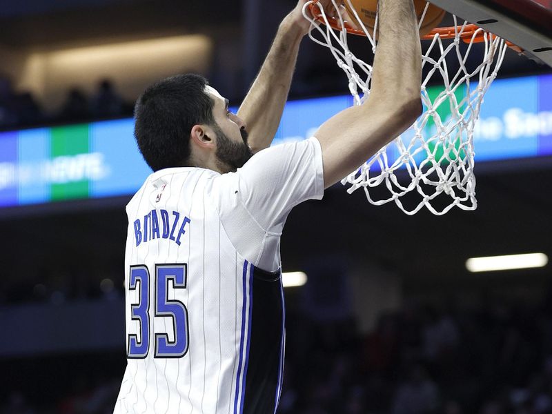 SACRAMENTO, CALIFORNIA - JANUARY 03: Goga Bitadze #35 of the Orlando Magic slam dunks against the Sacramento Kings during the second half of an NBA basketball game at Golden 1 Center on January 03, 2024 in Sacramento, California. NOTE TO USER: User expressly acknowledges and agrees that, by downloading and or using this photograph, User is consenting to the terms and conditions of the Getty Images License Agreement. (Photo by Thearon W. Henderson/Getty Images)