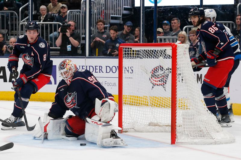 Mar 17, 2024; Columbus, Ohio, USA; Columbus Blue Jackets goalie Elvis Merzlikins (90) makes a pad save against the Winnipeg Jets during the third period at Nationwide Arena. Mandatory Credit: Russell LaBounty-USA TODAY Sports