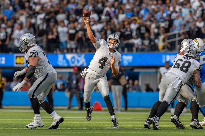 Las Vegas Raiders quarterback Aidan O'Connell (4) passes the ball against the Los Angeles Chargers in an NFL football game, Sunday, Oct. 1, 2023, in Inglewood, Calif. Chargers won 24-17. (AP Photo/Jeff Lewis)