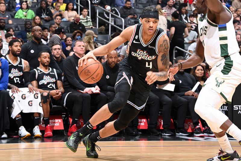 LOS ANGELES, CA - FEBRUARY 10: Brandon Boston Jr. #4 of the LA Clippers dribbles the ball during the game against the Milwaukee Bucks on February 10, 2023 at Crypto.Com Arena in Los Angeles, California. NOTE TO USER: User expressly acknowledges and agrees that, by downloading and/or using this Photograph, user is consenting to the terms and conditions of the Getty Images License Agreement. Mandatory Copyright Notice: Copyright 2023 NBAE (Photo by Andrew D. Bernstein/NBAE via Getty Images)