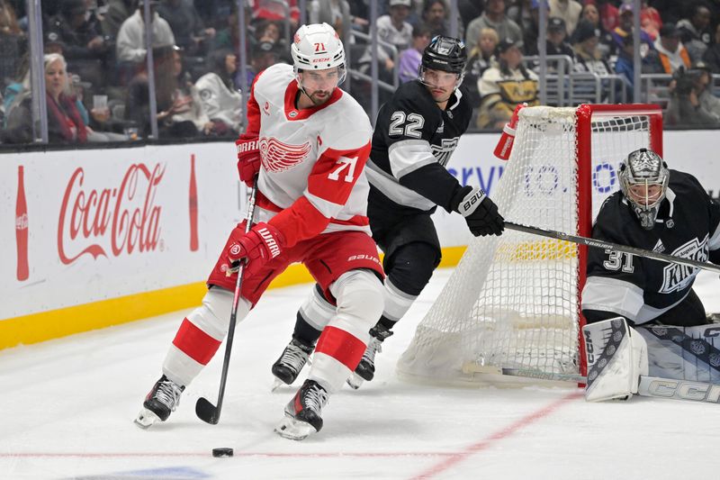 Nov 16, 2024; Los Angeles, California, USA; Detroit Red Wings center Dylan Larkin (71) is chased down by Los Angeles Kings left wing Kevin Fiala (22) in the first period at Crypto.com Arena. Mandatory Credit: Jayne Kamin-Oncea-Imagn Images