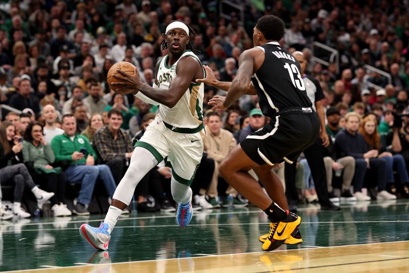 BOSTON, MASSACHUSETTS - NOVEMBER 10: Jrue Holiday #4 of the Boston Celtics drives to the basket against Armoni Brooks #13 of the Brooklyn Nets  during the first quarter of their In-Season Tournament game at TD Garden on November 10, 2023 in Boston, Massachusetts. NOTE TO USER: User expressly acknowledges and agrees that, by downloading and or using this photograph, User is consenting to the terms and conditions of the Getty Images License Agreement. (Photo by Maddie Meyer/Getty Images)