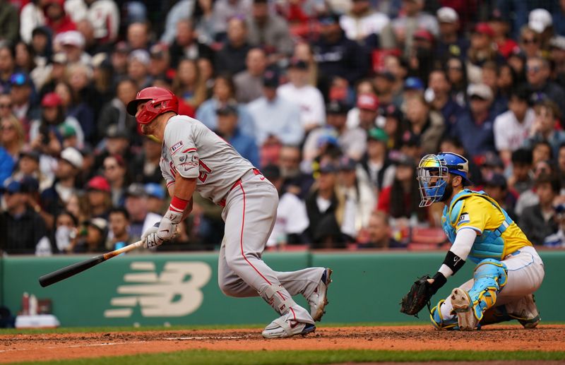 Apr 14, 2024; Boston, Massachusetts, USA; Los Angeles Angels center fielder Mike Trout (27) hits a triple against the Boston Red Sox in the eighth inning at Fenway Park. Mandatory Credit: David Butler II-USA TODAY Sports