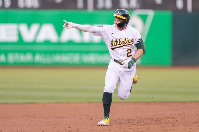 May 16, 2023; Oakland, California, USA; Oakland Athletics shortstop Nick Allen (2) signals after hitting a solo home run during the third inning against the Arizona Diamondbacks at Oakland-Alameda County Coliseum. Mandatory Credit: Stan Szeto-USA TODAY Sports