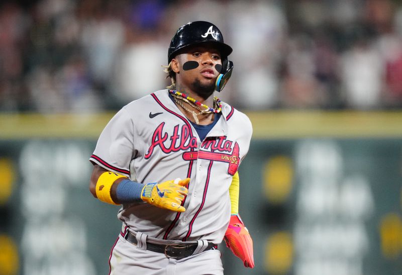 Aug 30, 2023; Denver, Colorado, USA; Atlanta Braves right fielder Ronald Acuna Jr. (13) advances to third in the ninth inning against the Colorado Rockies at Coors Field. Mandatory Credit: Ron Chenoy-USA TODAY Sports