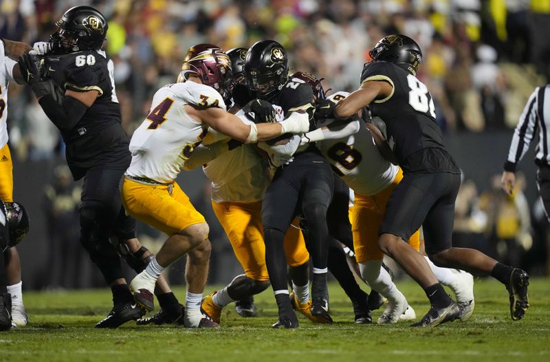 Oct 29, 2022; Boulder, Colorado, USA; Arizona State Sun Devils linebacker Kyle Soelle (34) and defensive lineman Joe Moore (58) tackle Colorado Buffaloes running back Deion Smith (20) in the second quarter at Folsom Field. Mandatory Credit: Ron Chenoy-USA TODAY Sports