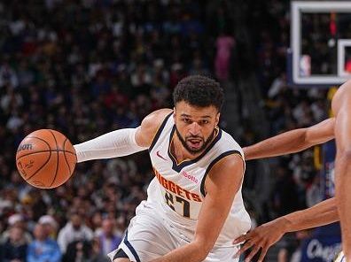 DENVER, CO - DECEMBER 25: Jamal Murray #27 of the Denver Nuggets handles the ball during the game against the Golden State Warriors on December 25, 2023 at the Ball Arena in Denver, Colorado. NOTE TO USER: User expressly acknowledges and agrees that, by downloading and/or using this Photograph, user is consenting to the terms and conditions of the Getty Images License Agreement. Mandatory Copyright Notice: Copyright 2023 NBAE (Photo by Bart Young/NBAE via Getty Images)