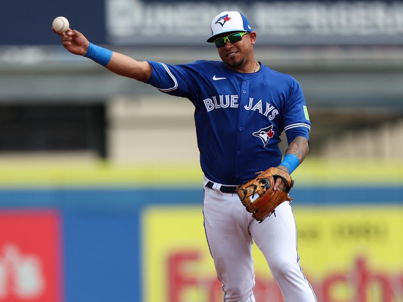 Feb 29, 2024; Dunedin, Florida, USA;  Toronto Blue Jays infielder Eduardo Escobar (3) throws to first fro an out against the Philadelphia Phillies in the first inning at TD Ballpark. Mandatory Credit: Nathan Ray Seebeck-USA TODAY Sports