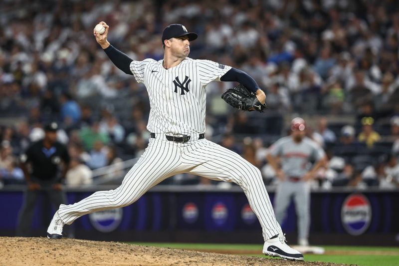 Jul 3, 2024; Bronx, New York, USA; New York Yankees pitcher Clay Holmes (35) pitches in the ninth inning against the Cincinnati Reds at Yankee Stadium. Mandatory Credit: Wendell Cruz-USA TODAY Sports