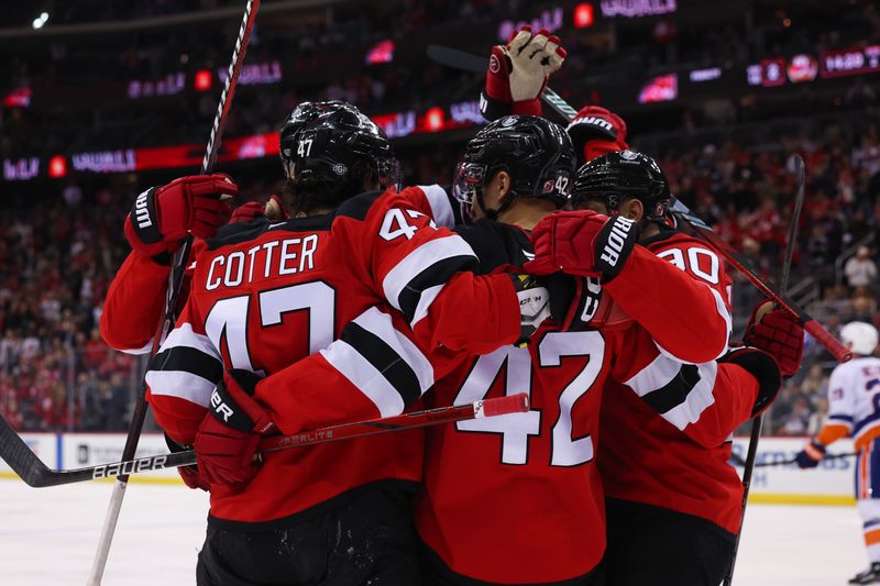 Oct 25, 2024; Newark, New Jersey, USA; New Jersey Devils center Curtis Lazar (42) celebrates his goal against the New York Islanders during the second period at Prudential Center. Mandatory Credit: Ed Mulholland-Imagn Images